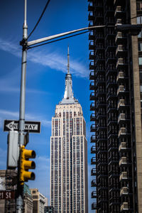 Empire state building against blue sky