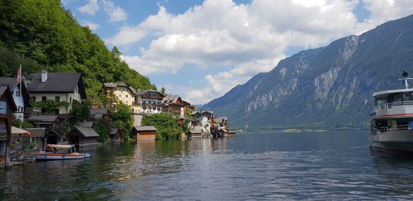 Panoramic view of buildings and mountains against sky