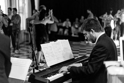 Group of people playing piano