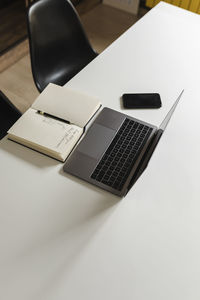 High angle view of smart phone on table