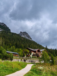 Scenic view of building and mountains against sky