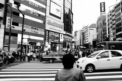 People walking on road in city