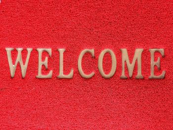 Full frame shot of welcome text on doormat