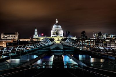 Illuminated modern building against sky at night