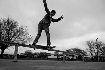 Portrait of skateboarder sliding