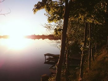 Scenic view of river at sunset