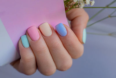 Cropped hand of woman holding pills