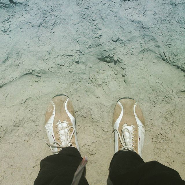 low section, person, shoe, personal perspective, standing, lifestyles, human foot, footwear, high angle view, leisure activity, men, unrecognizable person, sand, street, beach, outdoors, day