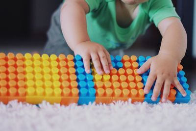 Boy playing with toy toys at home