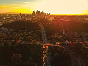 High angle view of city buildings during sunset