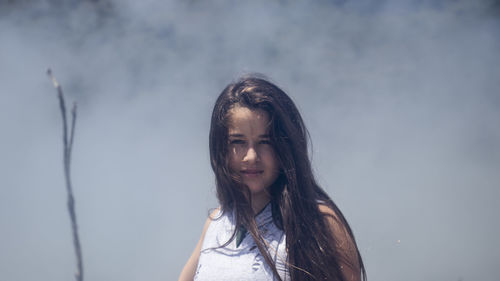 Portrait of girl against smoke