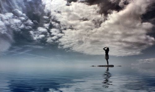 Full length of woman jumping in sea