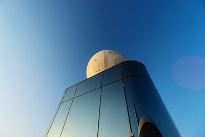 Low angle view of tower against clear blue sky