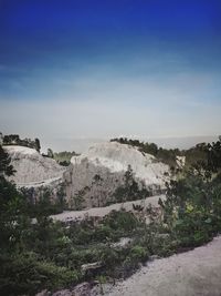 Scenic view of landscape against blue sky