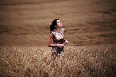 Woman standing on field