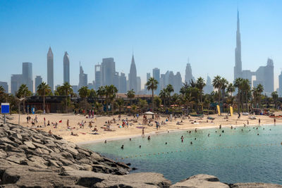 Panoramic view of popular la mer beach in dubai, uae. coastline with azure sea and high rises 