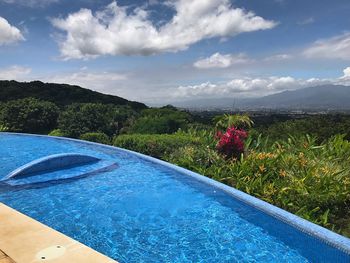 Scenic view of swimming pool against sky