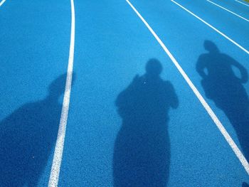 Shadow of people on playing field