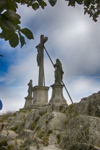 Low angle view of statue against sky