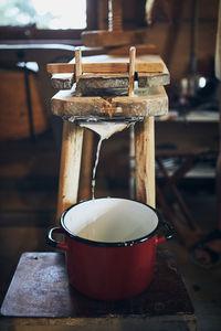 Cheese making. making cottage cheese using cheese press and traditional old technique. old kitchen