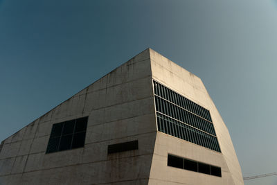 Low angle view of modern building against clear sky