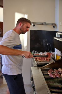 Man preparing food in kitchen