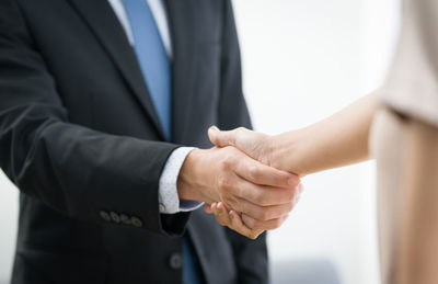 Midsection of woman holding hands