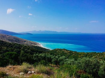 Scenic view of sea against blue sky