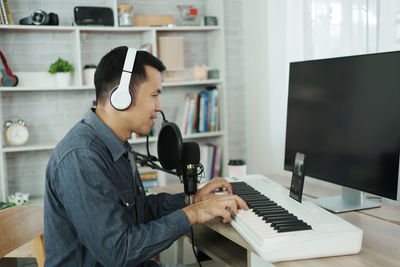 Portrait of woman using laptop at home