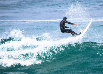 People surfing in sea