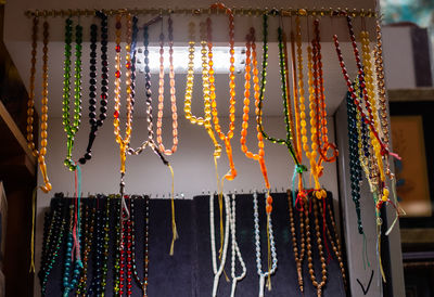 Multi colored umbrellas hanging at market stall