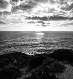 View of calm sea against cloudy sky