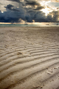 Scenic view of beach against sky during sunset