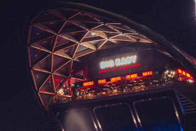 View of illuminated ferris wheel at night