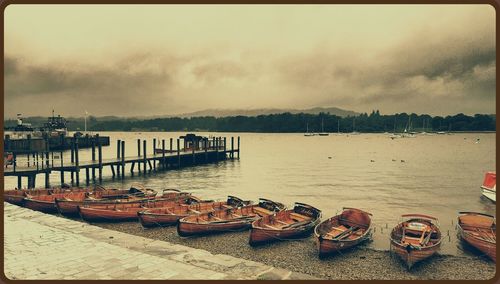 Boats moored at pier
