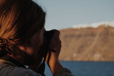 Close-up woman photographing outdoors