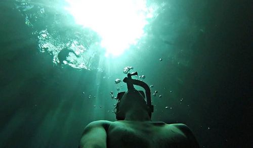 Man swimming in sea