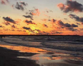 Scenic view of sea against sky at sunset