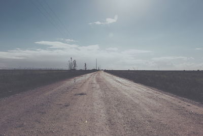 Scenic view of landscape against cloudy sky