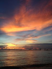 Scenic view of sea against romantic sky at sunset