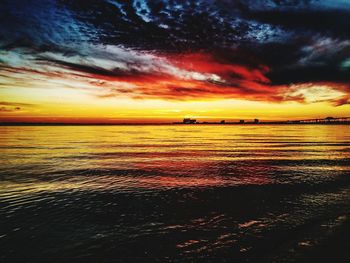 Scenic view of sea against dramatic sky