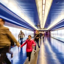 Full length of woman standing by railing