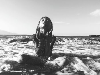 Child playing in the sea