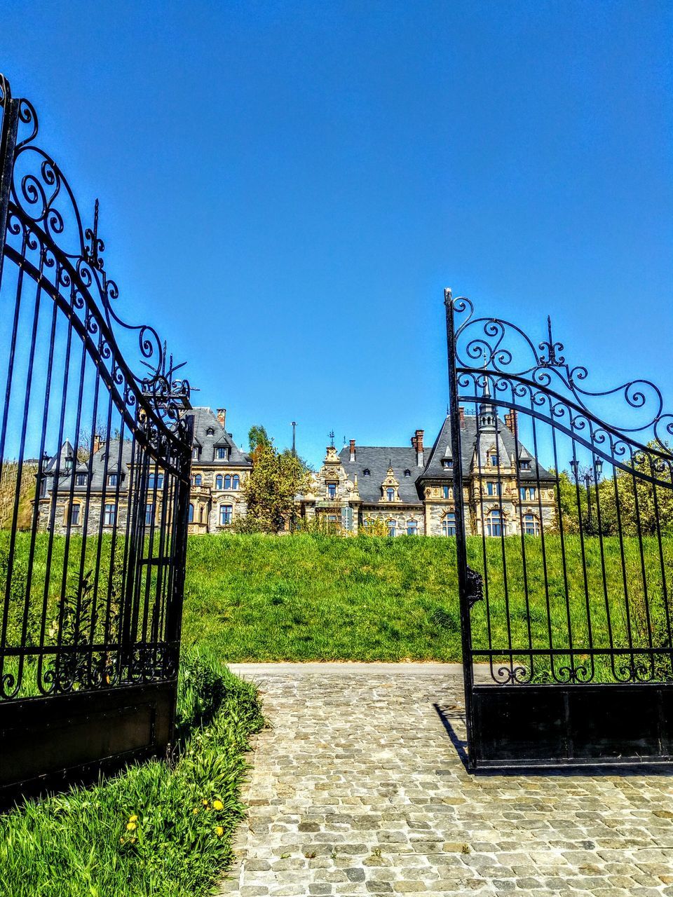 METAL GATE AGAINST BLUE SKY