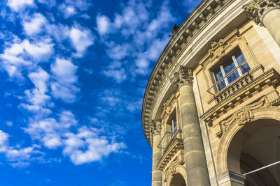 Low angle view of clock tower against sky