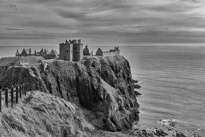 Panoramic view of sea and buildings against sky