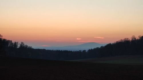 Scenic view of silhouette landscape against sky during sunset