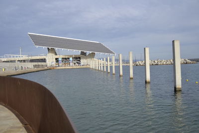 Pier over sea against sky