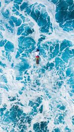 High angle view of man surfing in sea