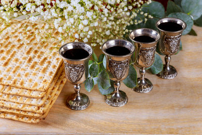 Close-up of wine glasses on table